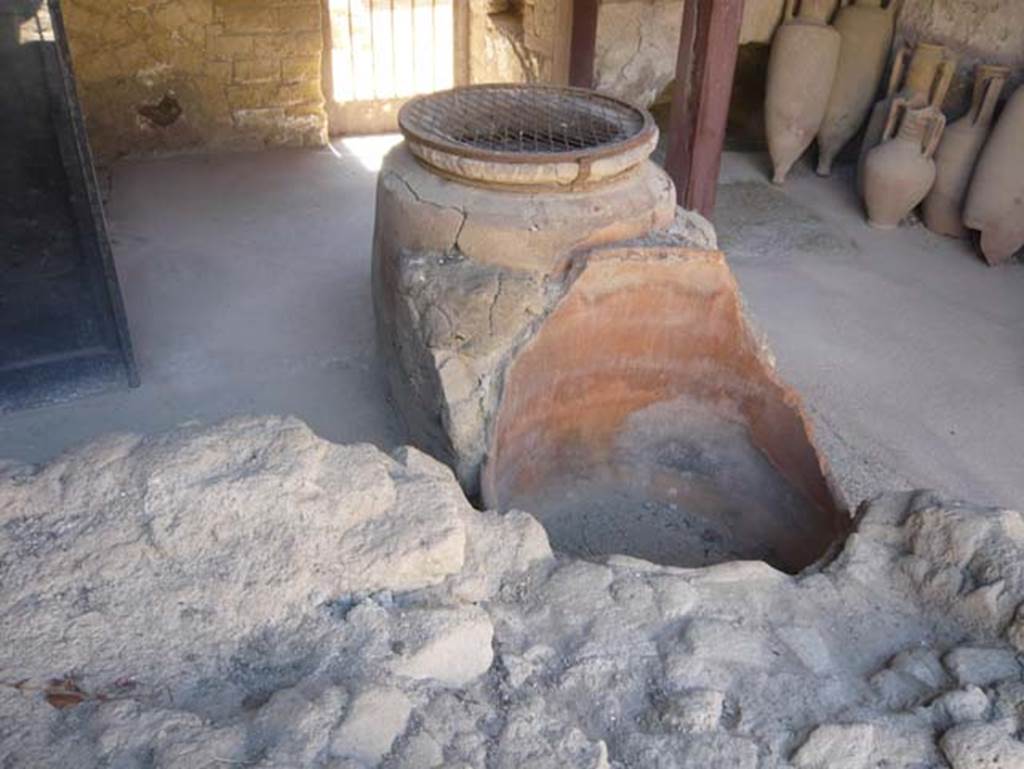 V 6, Herculaneum, August 2013. Looking east across counter with remains of dolia embedded in counter.  Photo courtesy of Buzz Ferebee.
